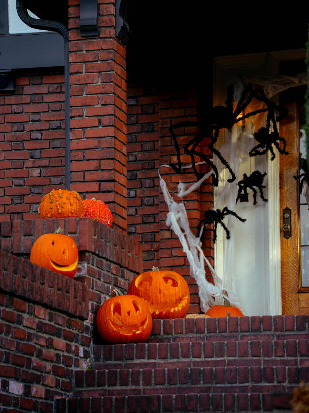 halloween decor front porch spiders and jack o lanterns 